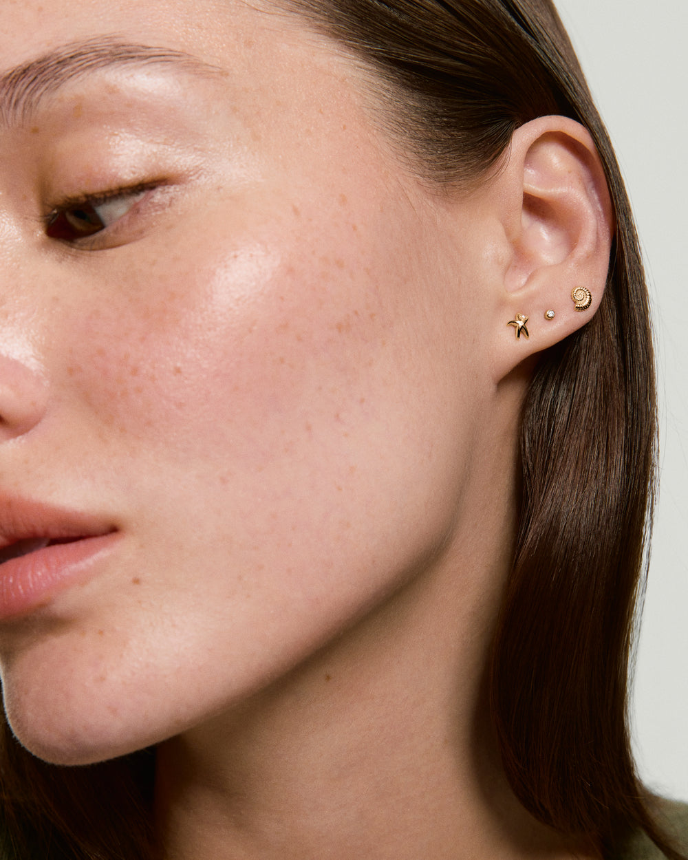 Ammonite Mini Studs – on model