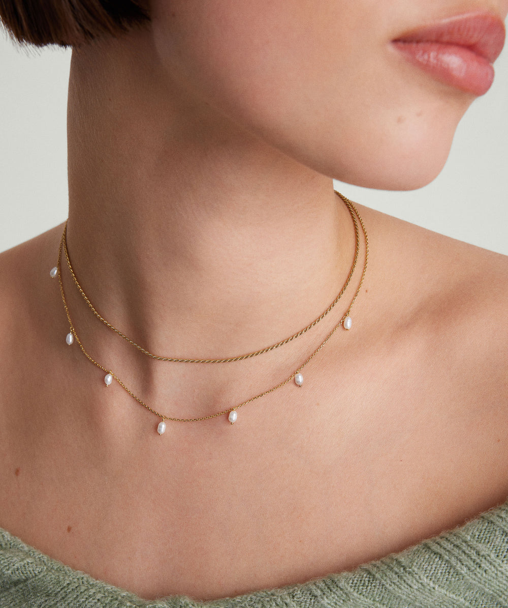 Elegant Tiny Pearl Station Necklace – on model